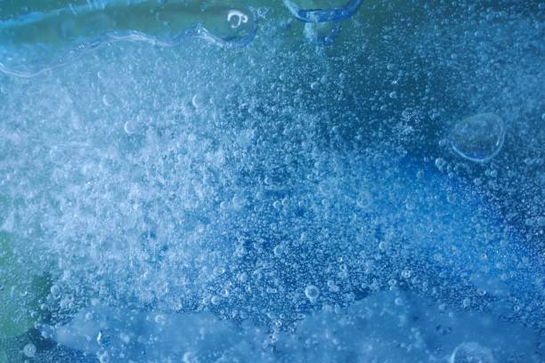 istock Ice background. Texture of blue ice with bubbles. Freshness and cold 1159533030