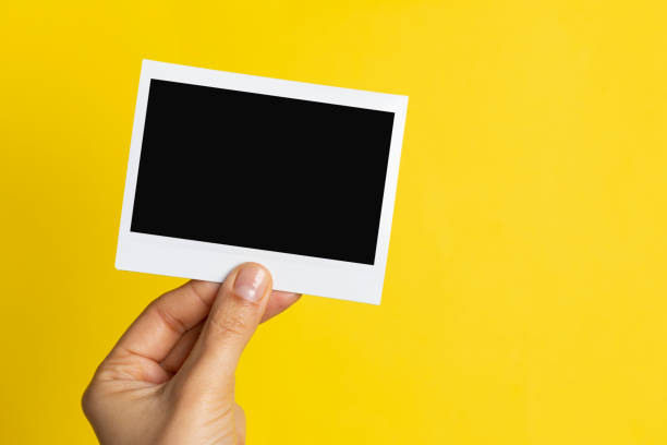 istock Hand Holding Instant Photo 1159533220