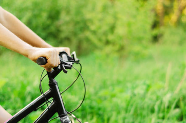 istock A man riding a mountain bike on a summer forest road. Summer active vacation. 1159534171