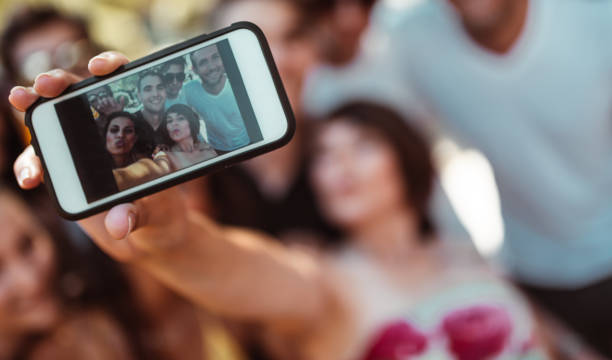 istock friends take a selfie all together 1159536848