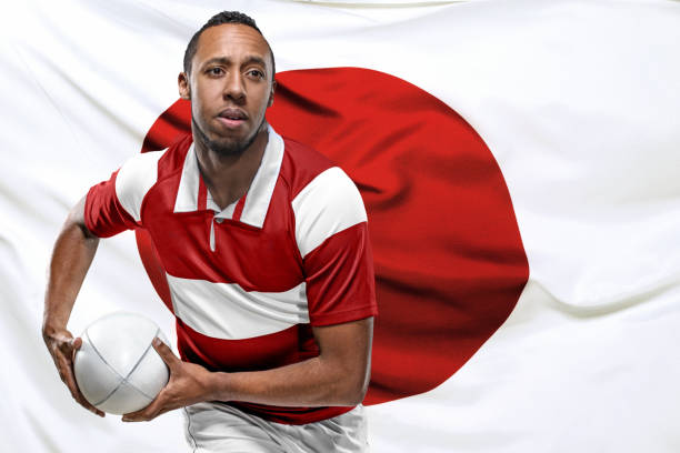 istock Rugby Player with ball and Japanese Flag 1159537216