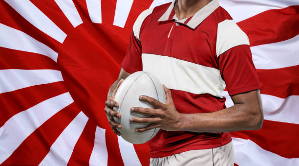 istock Rugby Player with ball and Japanese Flag 1159537945