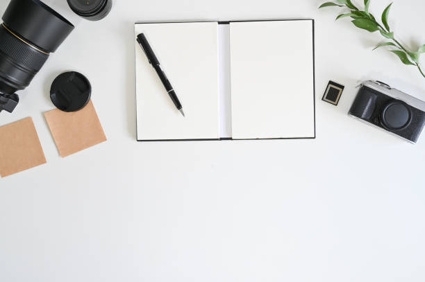 istock Workspace photographer with camera, lens, paper note and pen, Copy space concept. 1159538223