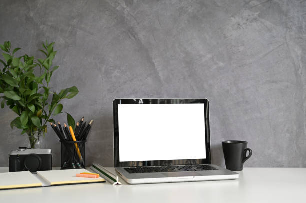 istock Workspace loft wall and laptop computer, coffee, pencil, camera on desk. 1159538259