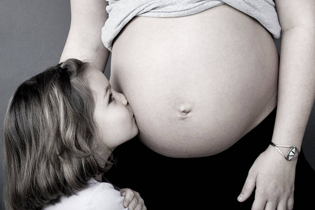 istock Kissing Mama's Belly 115953826