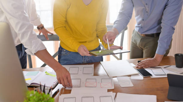 istock Snap shot web designer working on office desk, Website wireframe sketch by development. 1159538289