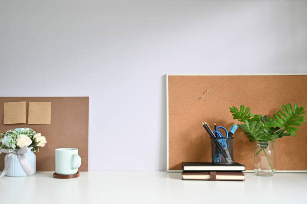 istock Workspace office supply, wood board and plant decoration on table. 1159538403