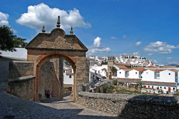 Philip V arch and old town, Ronda, Spain. View through the stone Philip V arch towards the white town, Ronda, Malaga Province, Andalucia, Spain, Europe. prince phillip stock pictures, royalty-free photos & images