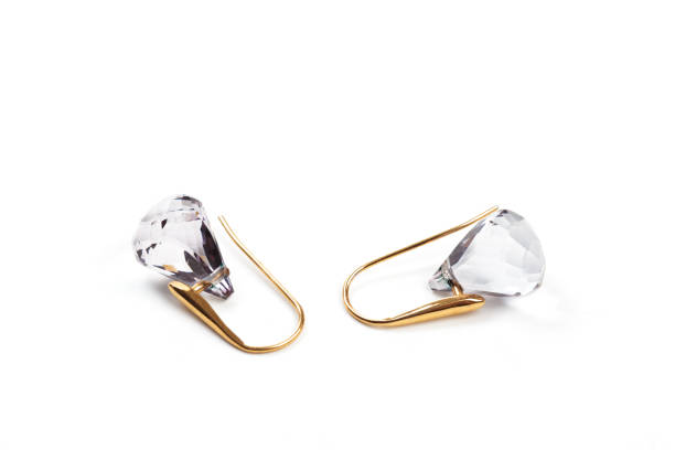 istock Golden earrings with gemstone isolated on white background. 1159540426