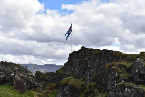 Photo of Icelandic flag at the Thingvellir National Park near Reykjavik at the Golden Circle in Iceland