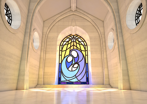An empty grand stone church interior lit by suns rays through a stained glass window depicting the nativity scene in the daytime - 3D render
