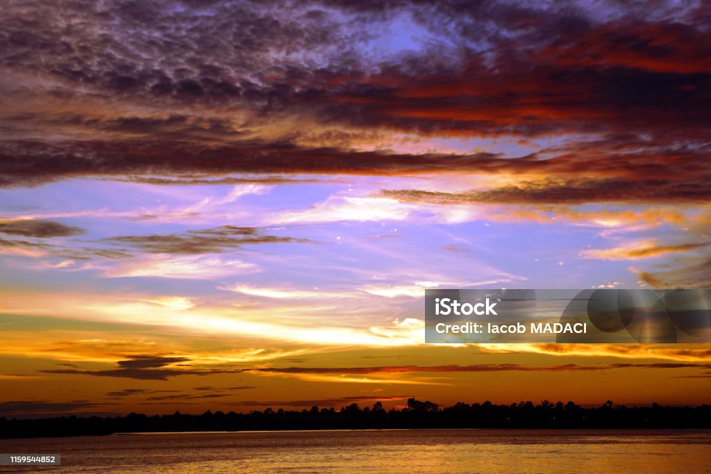 Sunset on the Rajang River in Sibu, Malaysia For further experience, allow yourself at least 30 minutes after the sun has disappeared under the horizon Archipelago Stock Photo