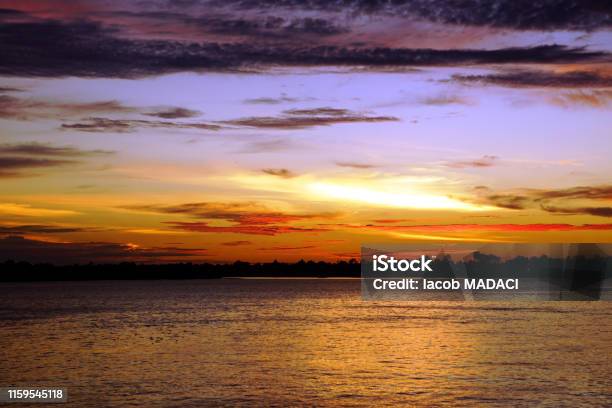 Sunset On The Rajang River In Sibu Malaysia Stock Photo - Download Image Now - Archipelago, Asia, Asia Pac