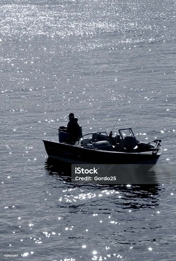 Pescador de silueta - Foto de stock de Motor eléctrico libre de derechos