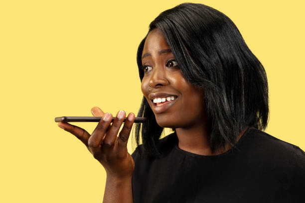 istock Young african woman isolated on yellow studio background, facial expression 1159548679