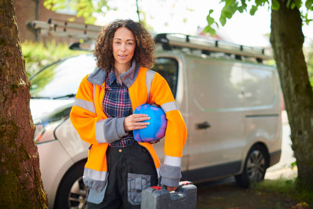 istock female electrician with van 1159552270