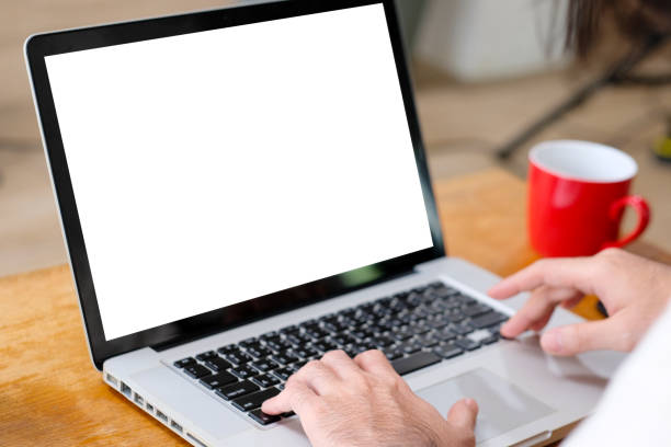 istock Man hands using laptop computer with blank screen for mock up template background, business technology and lifestyle background concept 1159552291