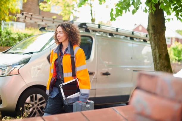 istock female heating engineer arrives at job 1159552420