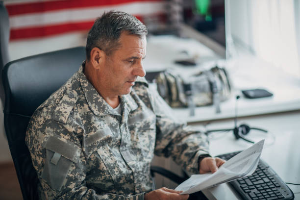 istock An old American soldier works in the office 1159553551