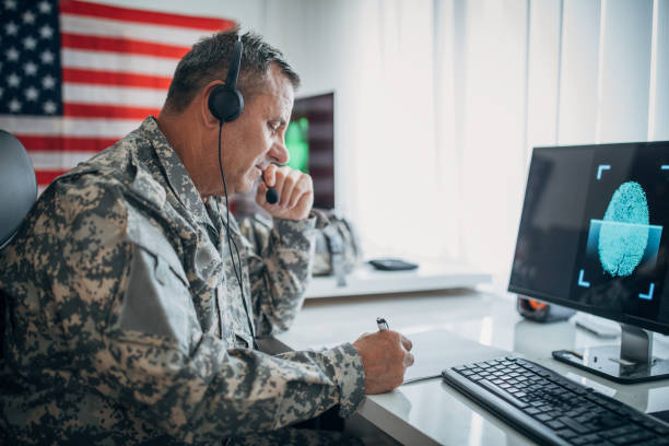 istock Senior soldier with headphones working 1159553815