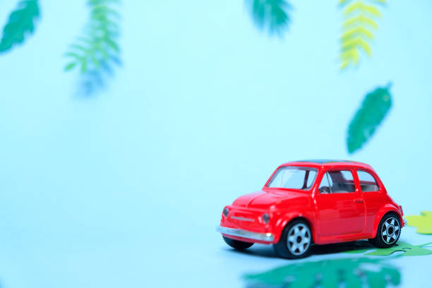 istock small toy red car driven by summer 1159555303