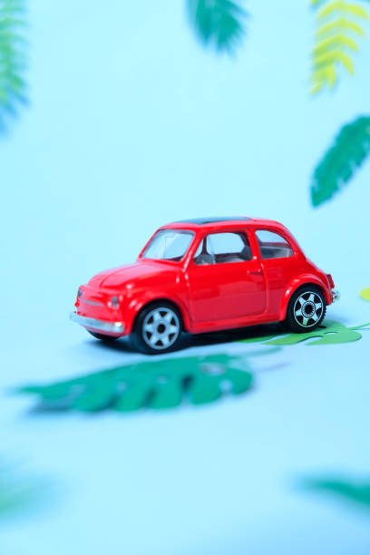 istock small toy red car driven by summer 1159555307