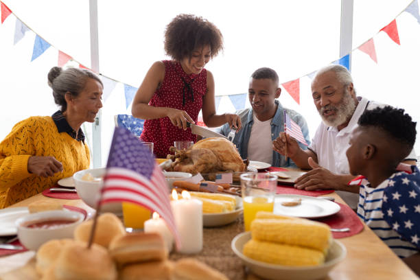 istock Multi-generation family sitting together for having meal on a dining table 1159556311