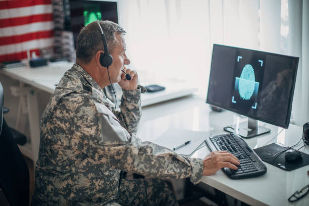 istock Senior soldier with headphones working 1159556983