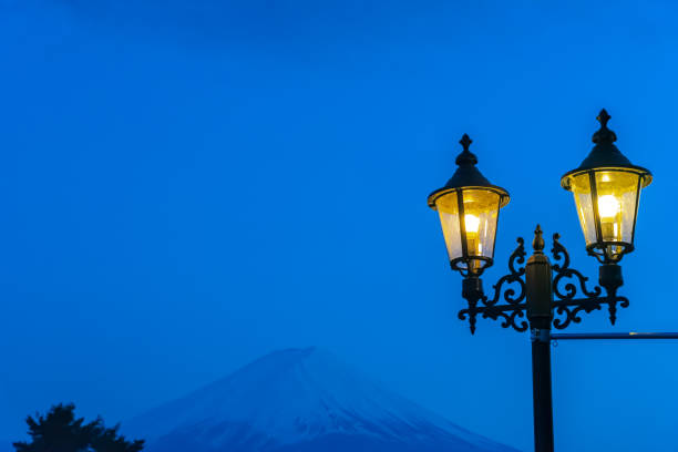 istock Close-up Street light and snow covered Mount Fuji 1159557746