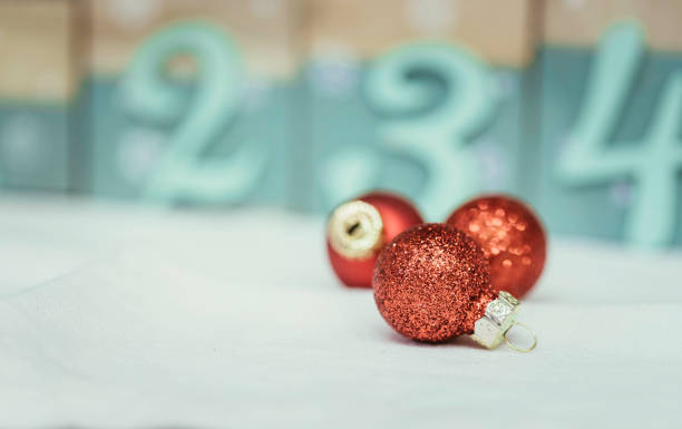 istock Red Christmas balls with decoration on shiny background 1159558853