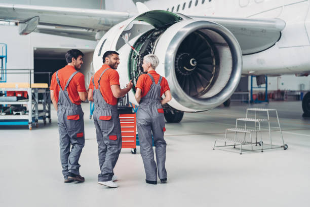istock Team of airplane mechanics 1159560379