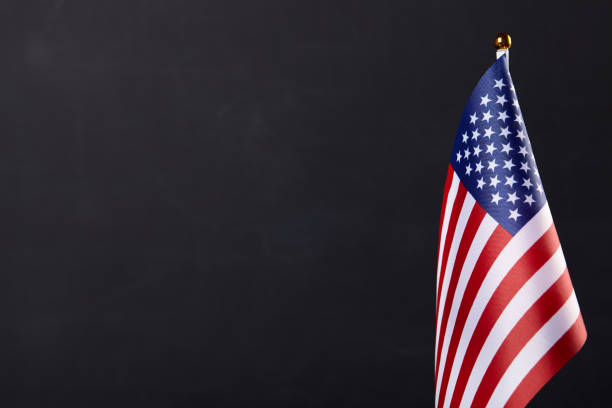 istock American flag on dark background. 1159561716