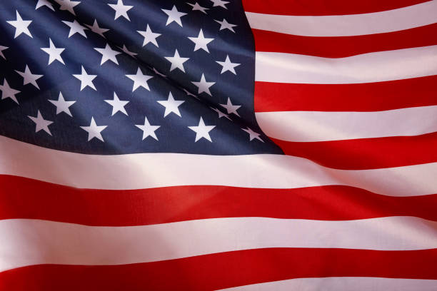 istock American flag background. Waving USA flag. 1159561821