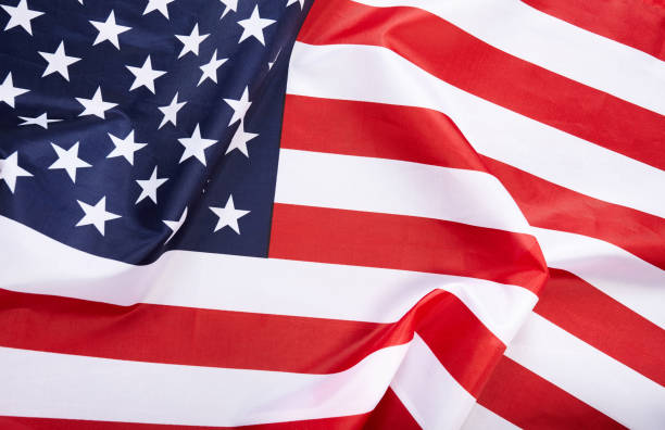 istock American flag background. Waving USA flag. 1159561860