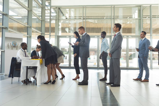 istock Group of diverse business people queuing up for interview 1159562789