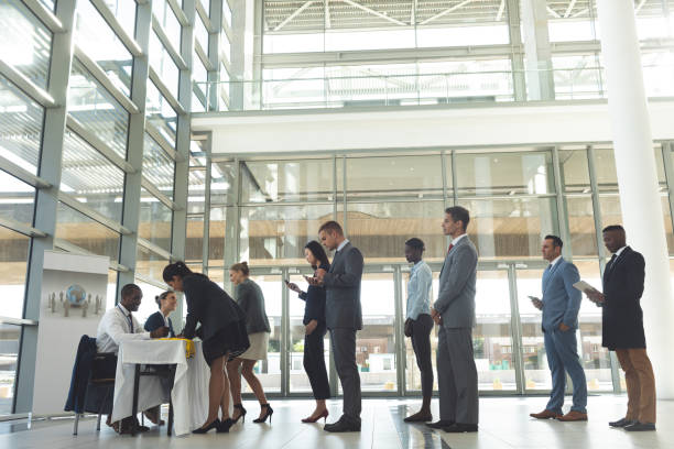 istock Group of diverse business people queuing up for interview 1159562832
