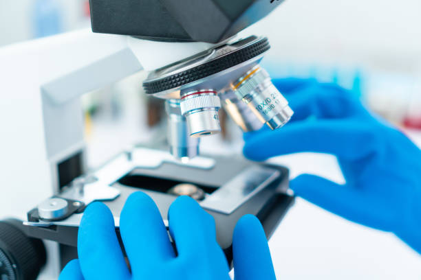 istock Close-up shot of microscope with metal lens at laboratory. 1159565747
