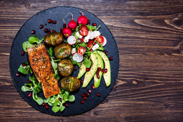 istock Roasted salmon and vegetables 1159566222