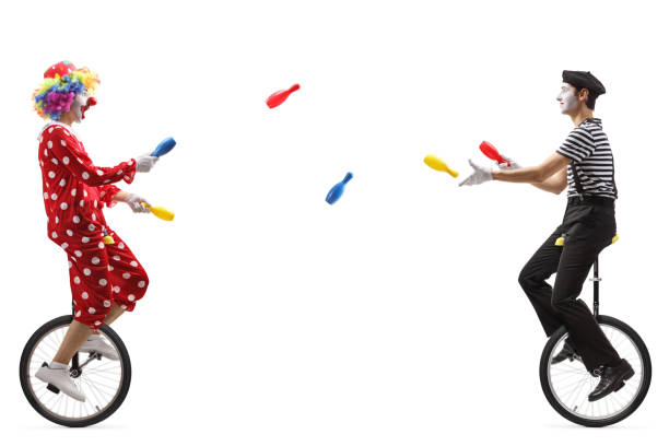 mime and clown on unicycles juggling with clubs - unicycle unicycling cycling wheel imagens e fotografias de stock