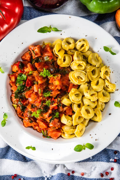 Spaghetti with tomato sauce and sausage Spaghetti with tomato sauce and sausage cooked selective focus vertical pasta stock pictures, royalty-free photos & images