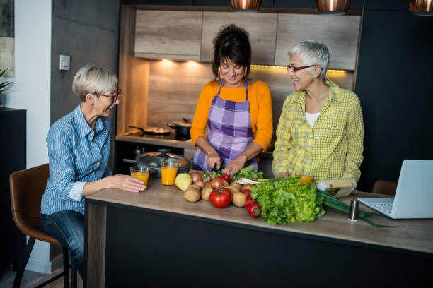 istock Senior women cooking together 1159568359