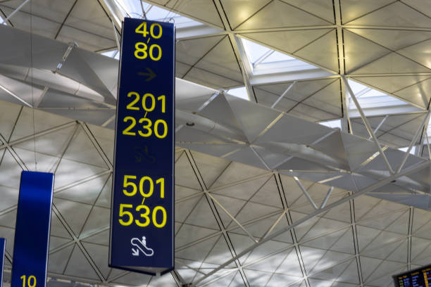 istock Yellow illuminated sign at airport with gate number. 1159568401