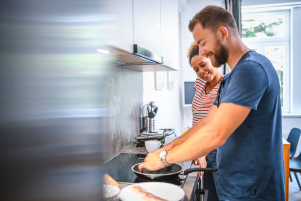 istock Modern Millennial Man Fixing Family Breakfast 1159568727