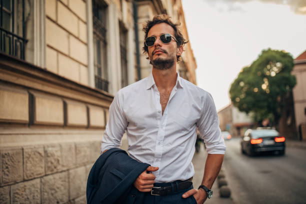 istock Handsome gentleman standing on the sidewalk 1159569711
