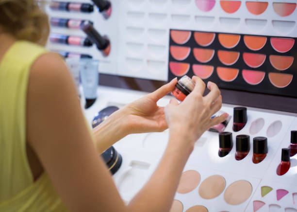 istock Woman trying make up in the store 1159569860