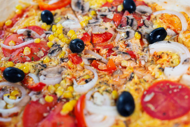 istock Top view fresh pizza with tomatoes, cheese and mushrooms 1159570534