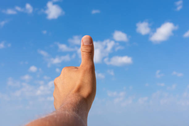 istock Thumbs up for the beautiful sky 1159571691