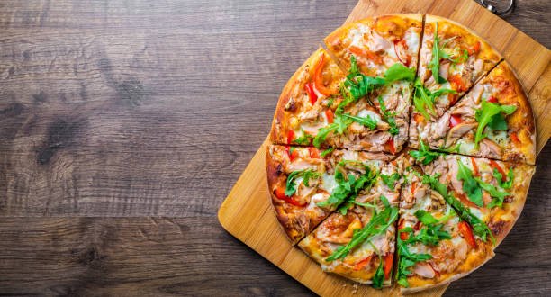 pizza with mozzarella cheese, salmon fish, tomato sauce, pepper. italian pizza on wooden table background - pizza tuna prepared fish cheese imagens e fotografias de stock