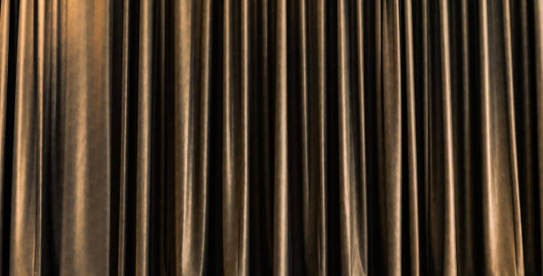 istock golden closed stage curtain with light effect 1159573799