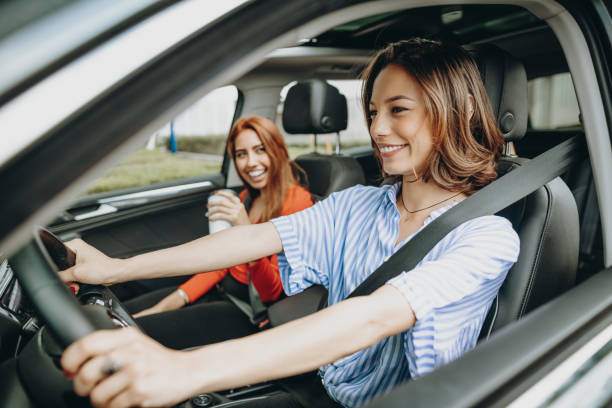 Millennial women sharing ride in car